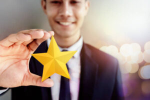 Employee holding a star.